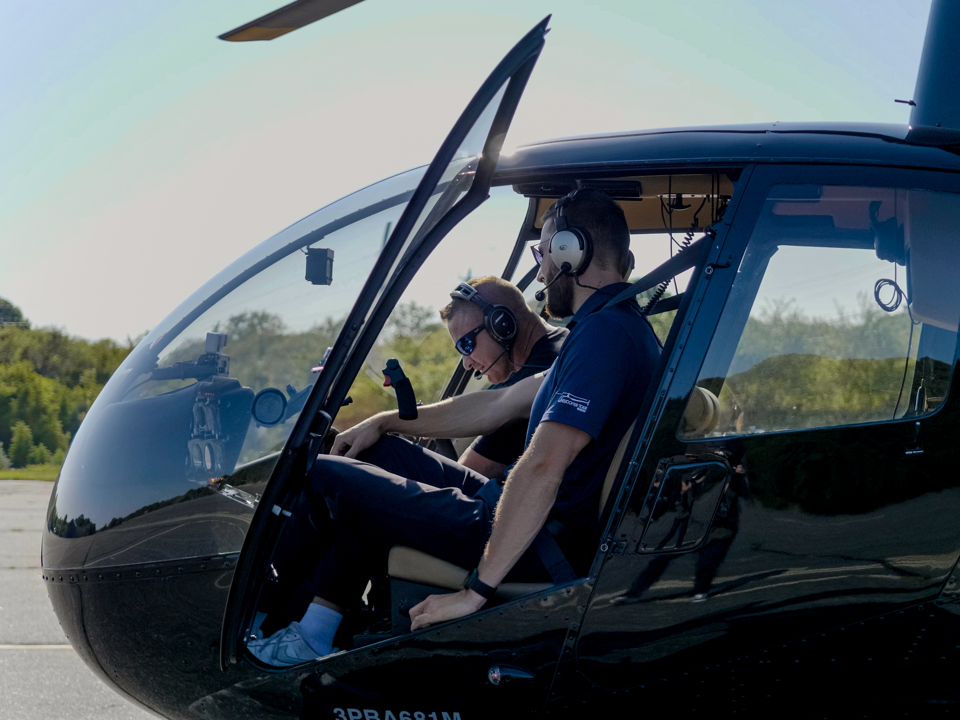 Student and instructor in helicopter cockpit