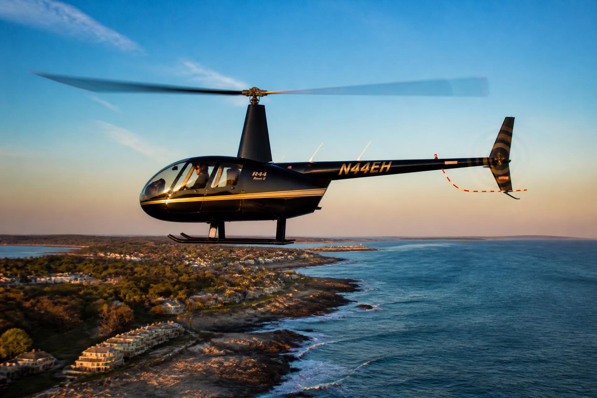 Helicopter in flight over the New England coast